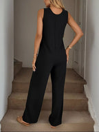 Plush Fashion Hub sleeveless button-front wide-leg jumpsuit with a comfortable fit, perfect for casual or chic summer looks.