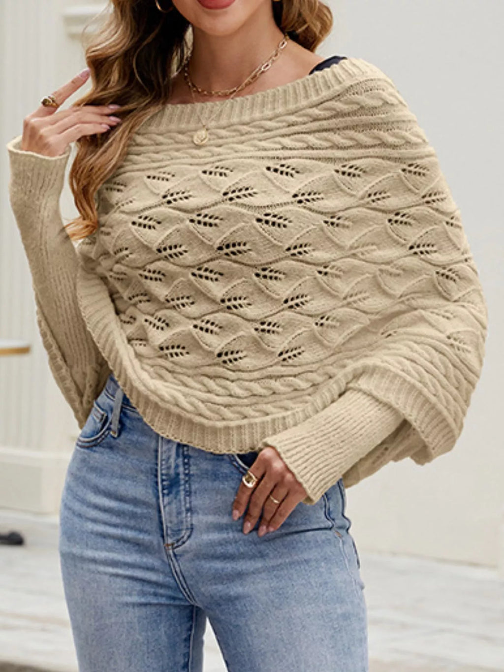 Cable knit batwing sleeve sweater from Trendsi, featuring a cozy, textured knit design and relaxed fit, ideal for casual wear.