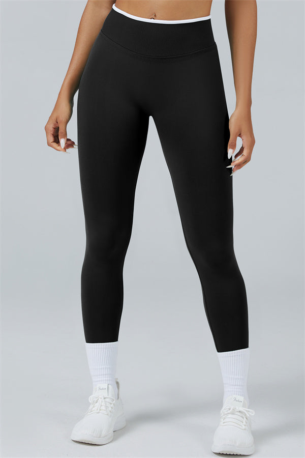Fitglutes Activewear long sleeve crop top and matching leggings set, designed for workouts, in vibrant athletic fabric.