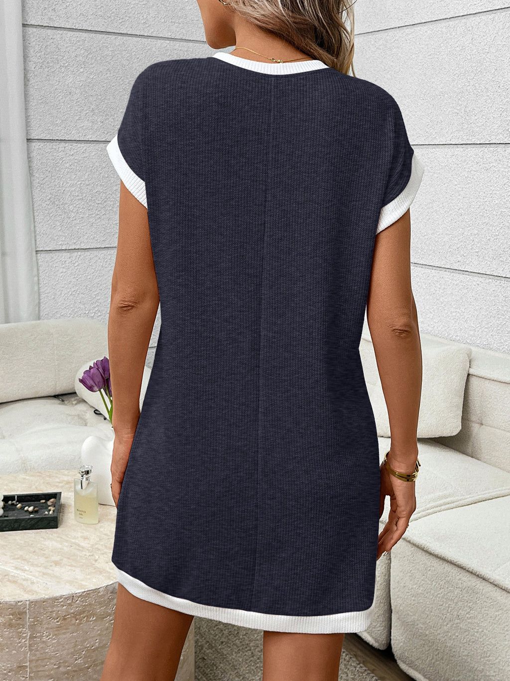 Ribbed knit mini dress with contrast trim and functional pocket, stylish dress by Trendsi featuring a fitted silhouette.