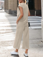 Women's notched short sleeve lounge set with pockets, 2-piece set by Trendsi, featuring comfortable fabric and relaxed fit.