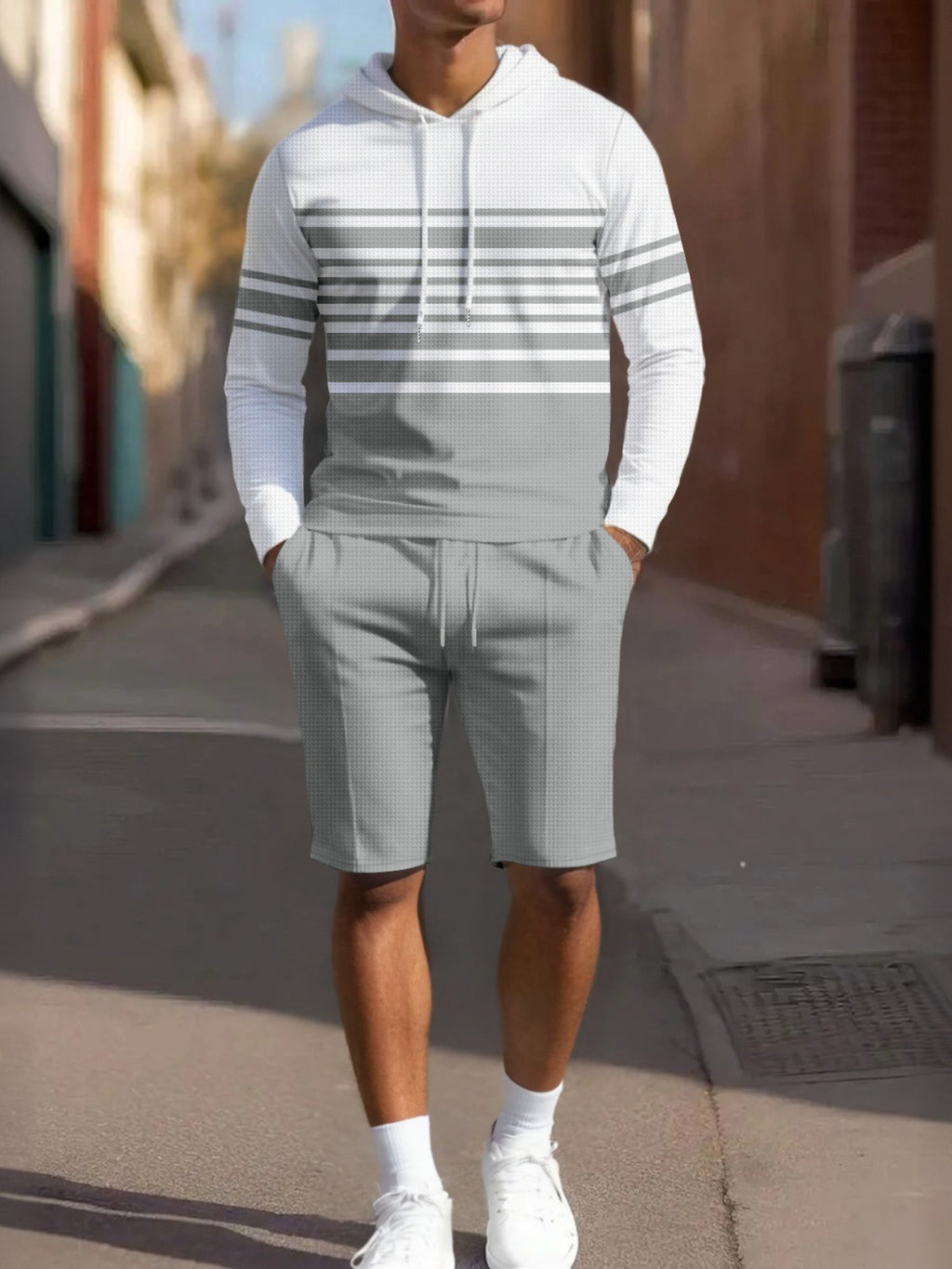 Men's full size striped hoodie and shorts casual set by Trendsi, featuring a comfortable, stylish matching top and bottoms.