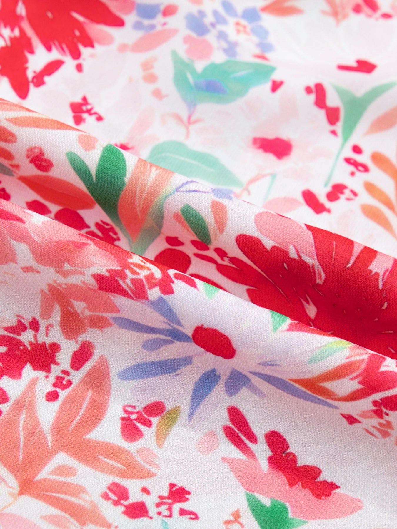Floral print tie-shoulder midi dress by Trendsi featuring pockets, lightweight summer dress with a flowing silhouette and summer floral pattern.
