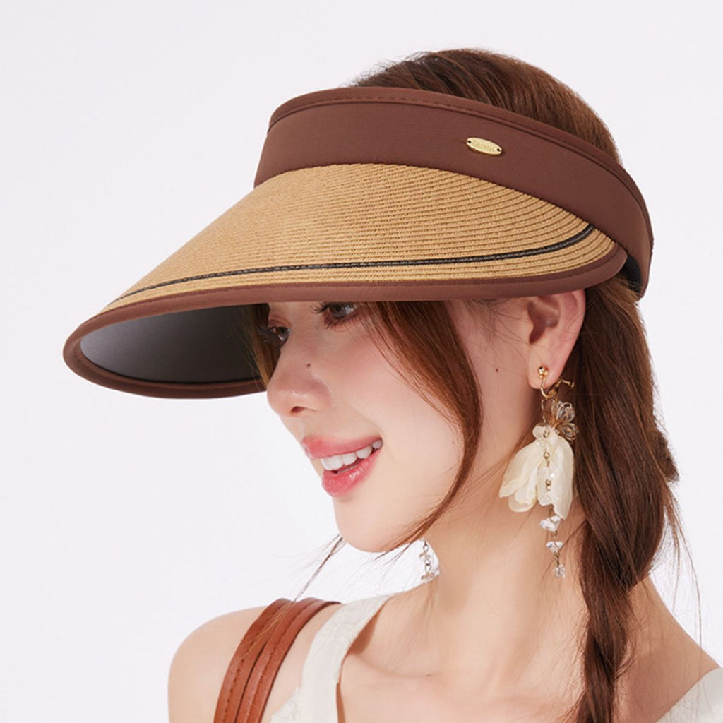 Women's wide brim straw visor hat by Trendsi with breathable design and UV sun protection, featuring a stylish woven straw look.