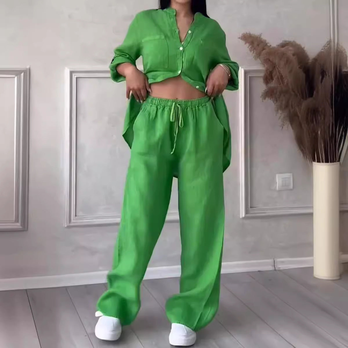 FitiqueFit wide-leg pants and lace-up top two-piece set in solid color, available in 12 colors, model wearing size S.