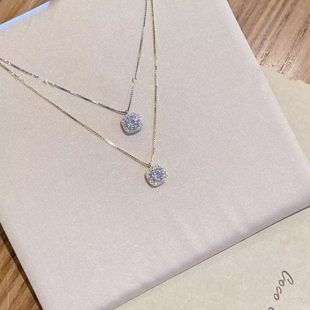 925 sterling silver zircon pendant necklace with a sparkling stone, displayed on a delicate chain.