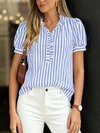 Women's striped puff sleeve blouse with ruffled details, featuring a stylish and feminine design from Trendsi.