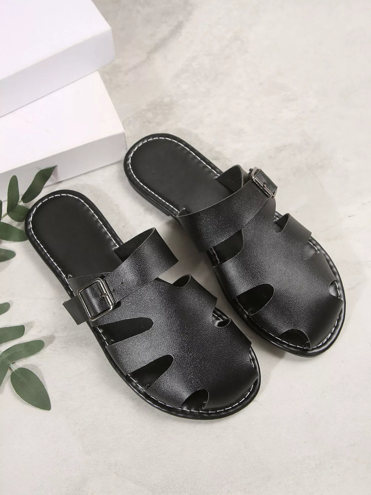 Comfortable Plush Fashion Hub slip-on leather sandals with adjustable buckle and cushioned sole, perfect for casual wear.