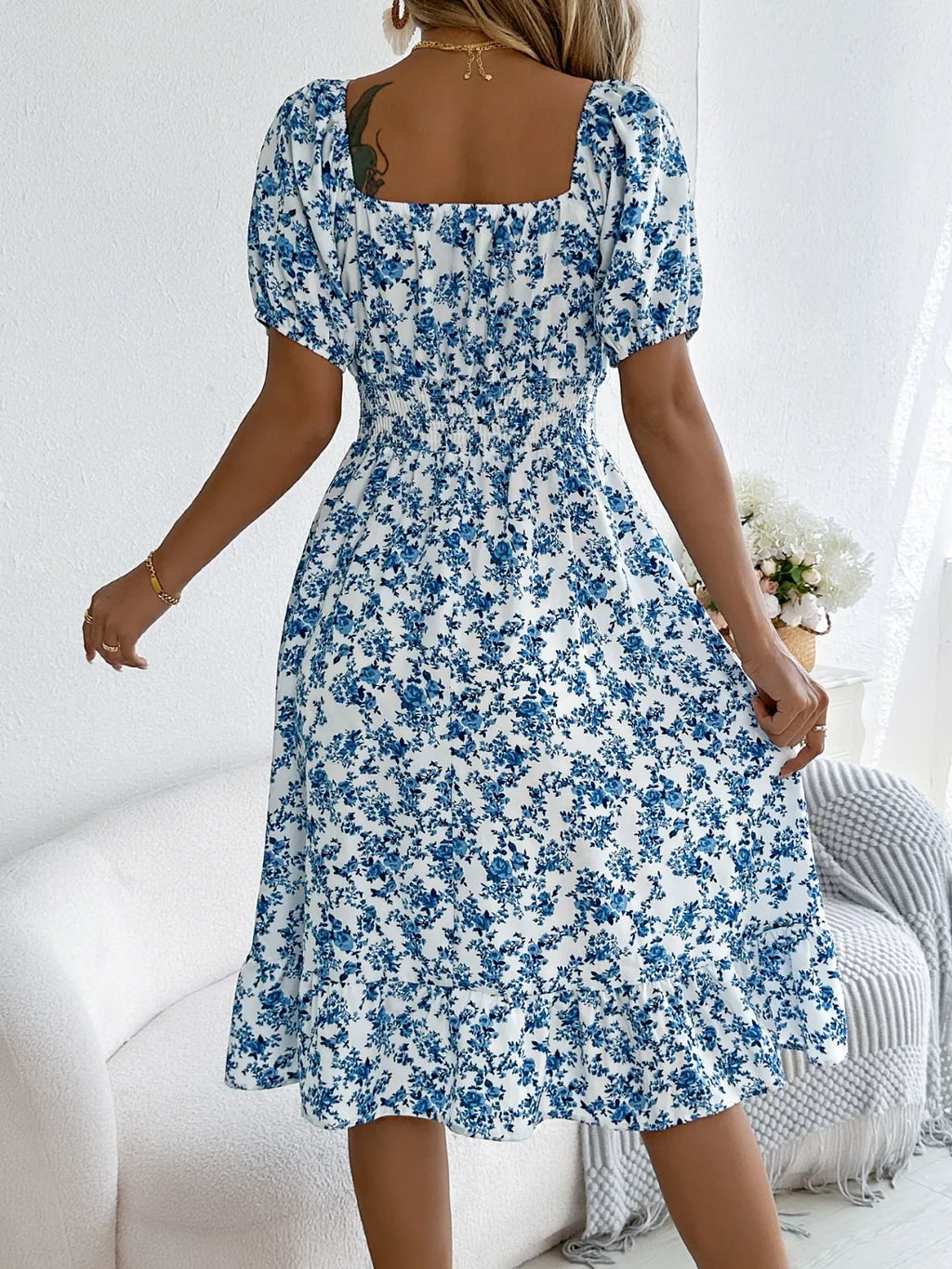 Shopimist floral puff sleeve dress with ruffled hem, featuring a feminine design and delicate floral pattern.