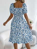 Shopimist floral puff sleeve dress with ruffled hem, featuring a feminine design and delicate floral pattern.