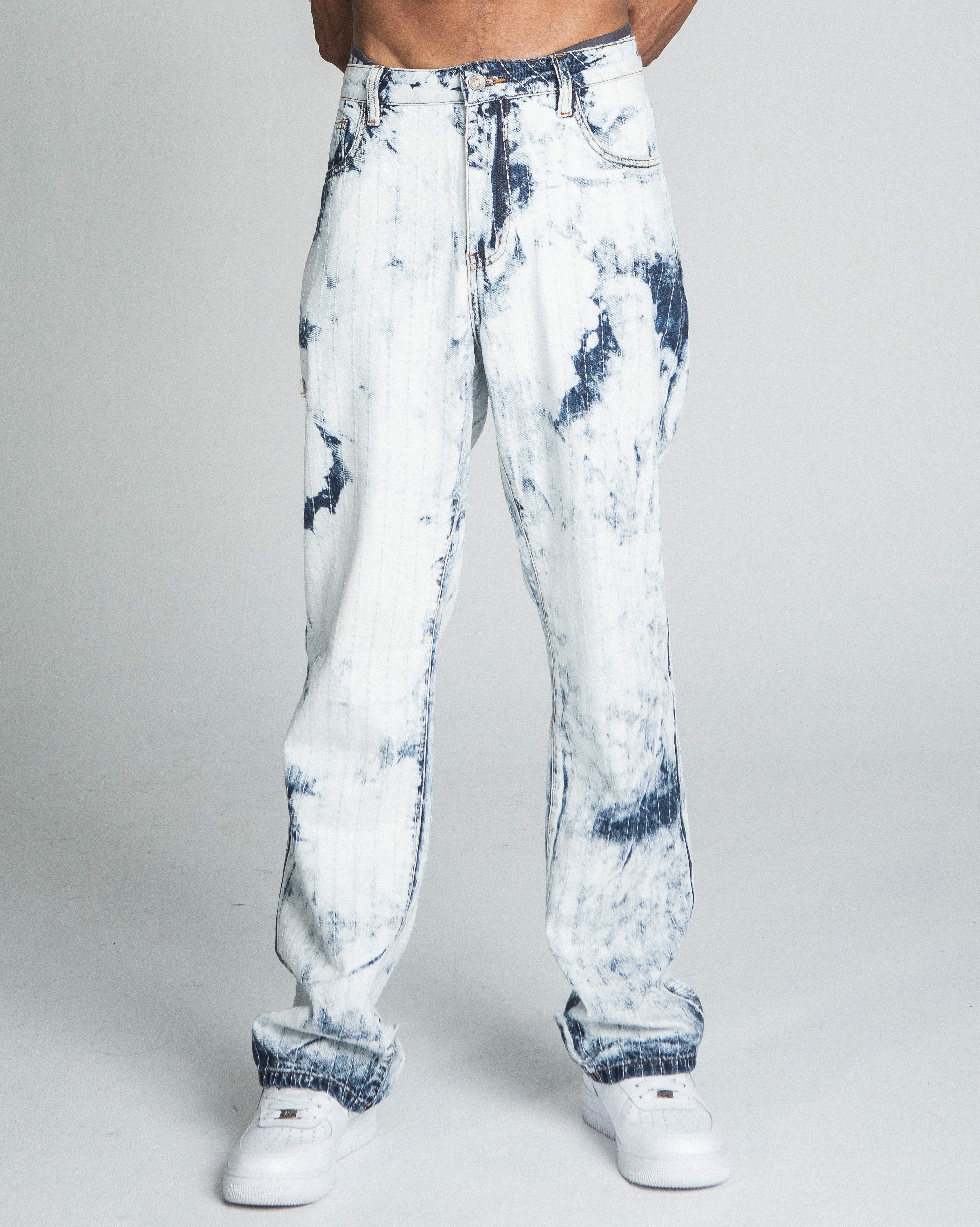 Dark blue and white tie-dye loose jeans by Armor Jeans featuring a relaxed fit and stylish distressed details.