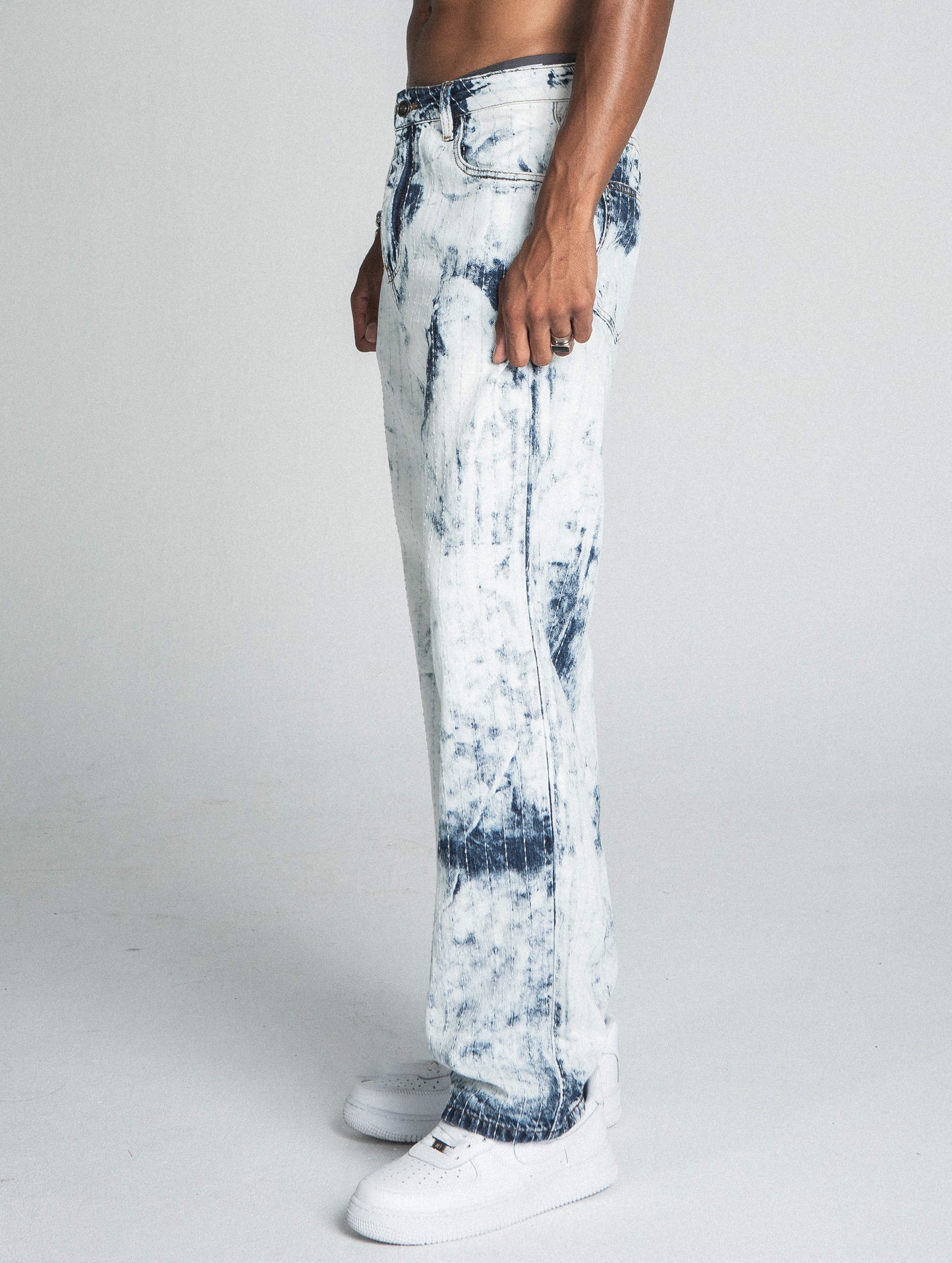 Dark blue and white tie-dye loose jeans from Plush Fashion Hub with thread line detailing, crafted from soft, comfortable denim fabric.