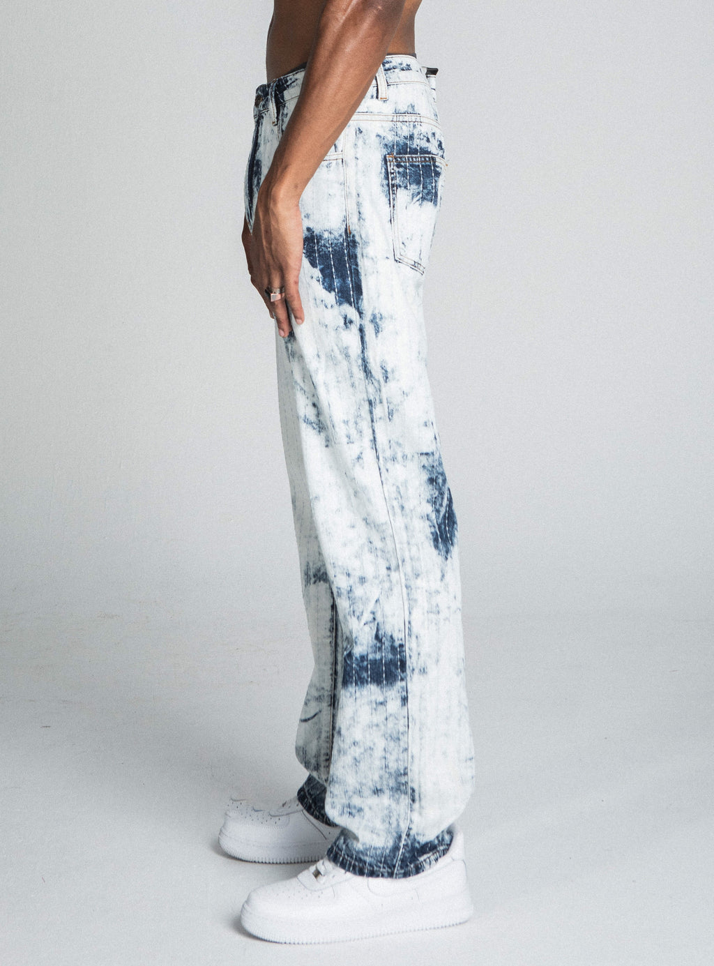Dark blue and white tie-dye loose jeans by Armor Jeans, featuring a relaxed fit and stylish distressed details.