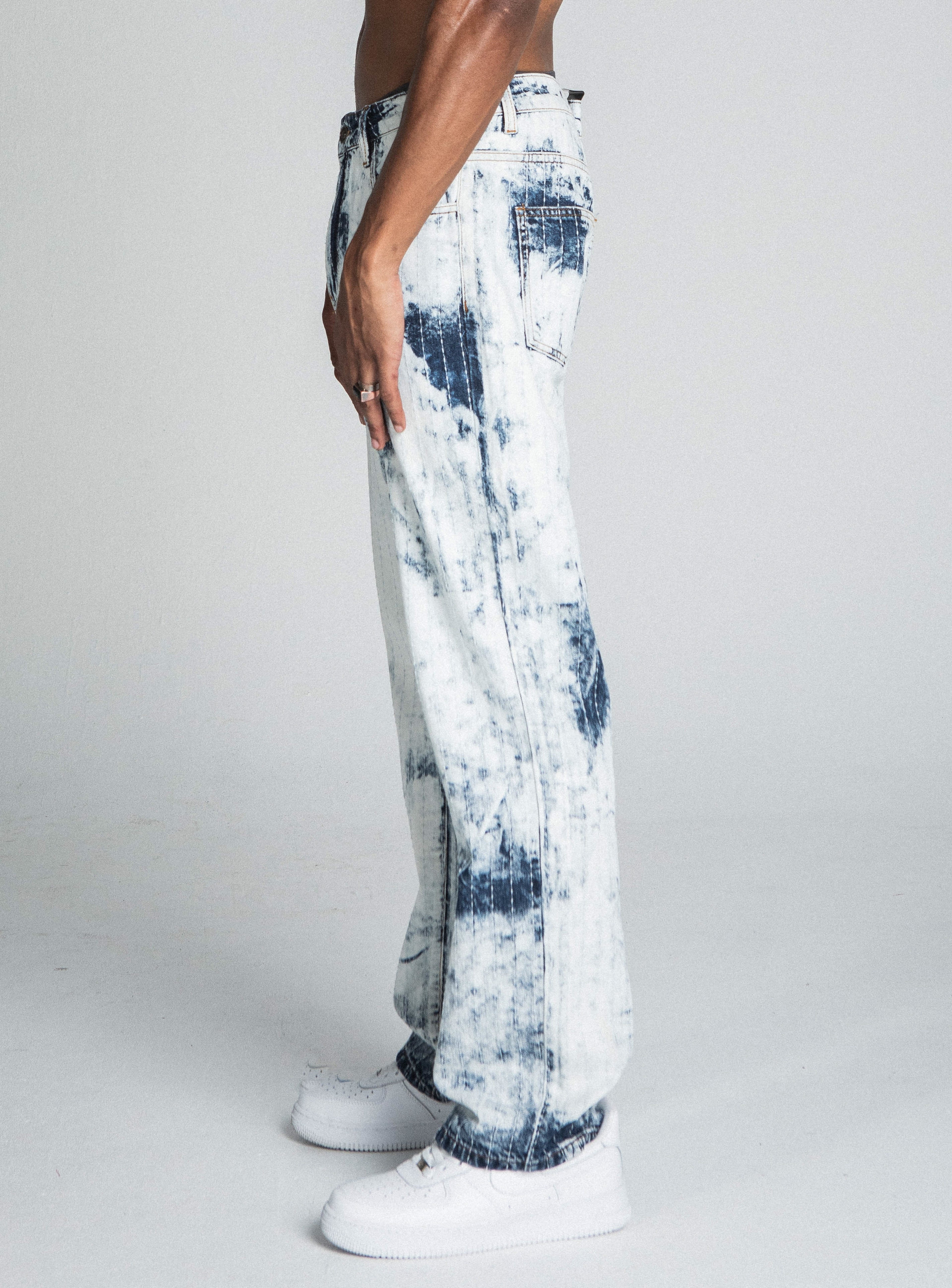 Dark blue and white tie-dye loose jeans by Armor Jeans, featuring a relaxed fit and stylish distressed details.