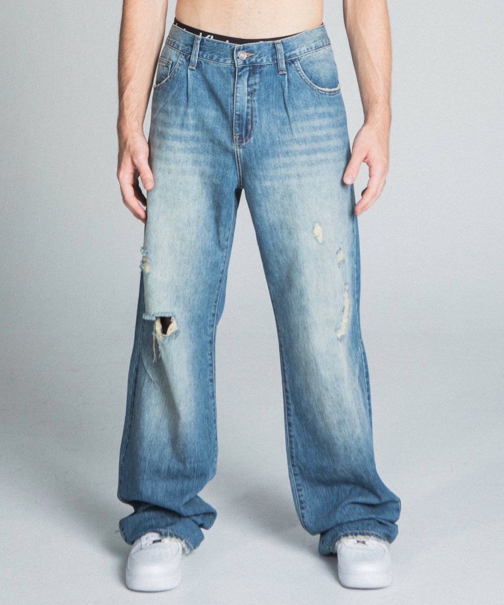Classic blue lightly distressed baggy jeans by Armor Jeans, featuring relaxed fit and casual style, shown in a detailed product image.
