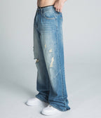 Lightly distressed blue baggy jeans from Armor Jeans, model AJ09-3, showcasing relaxed fit and casual style.
