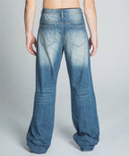 Lightly distressed classic blue baggy jeans from Armor Jeans, featuring a relaxed fit and casual style.