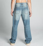 Ripped blue loose jeans by Armor Jeans, featuring distressed details and a relaxed fit, shown in the product image.