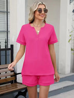 Solid color short sleeve top and matching shorts two-piece set by Trendsi, casual summer outfit with soft fabric and relaxed fit.
