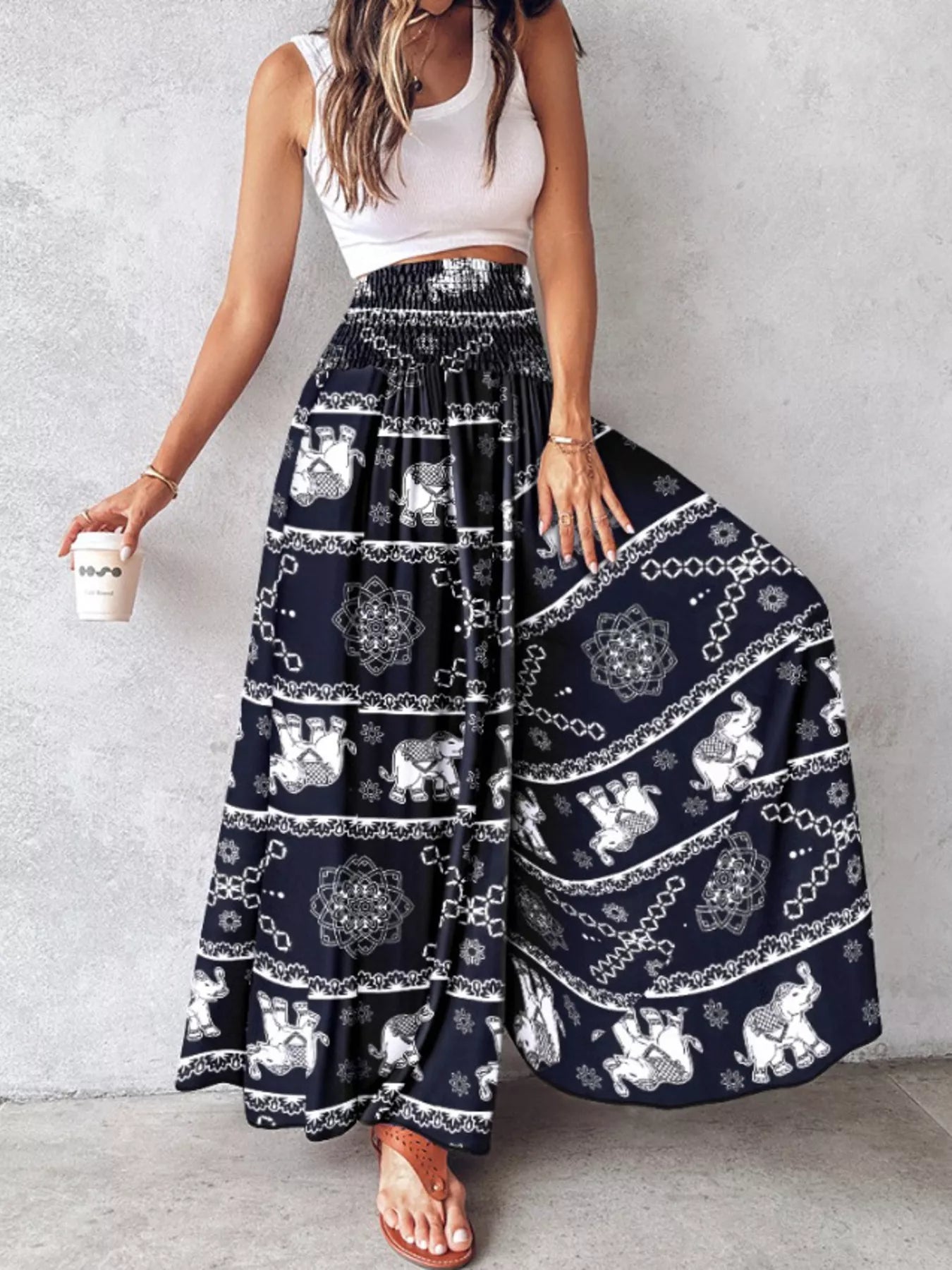 Printed wide-leg pants from Plush Fashion Hub with a colorful floral pattern and flowing silhouette.