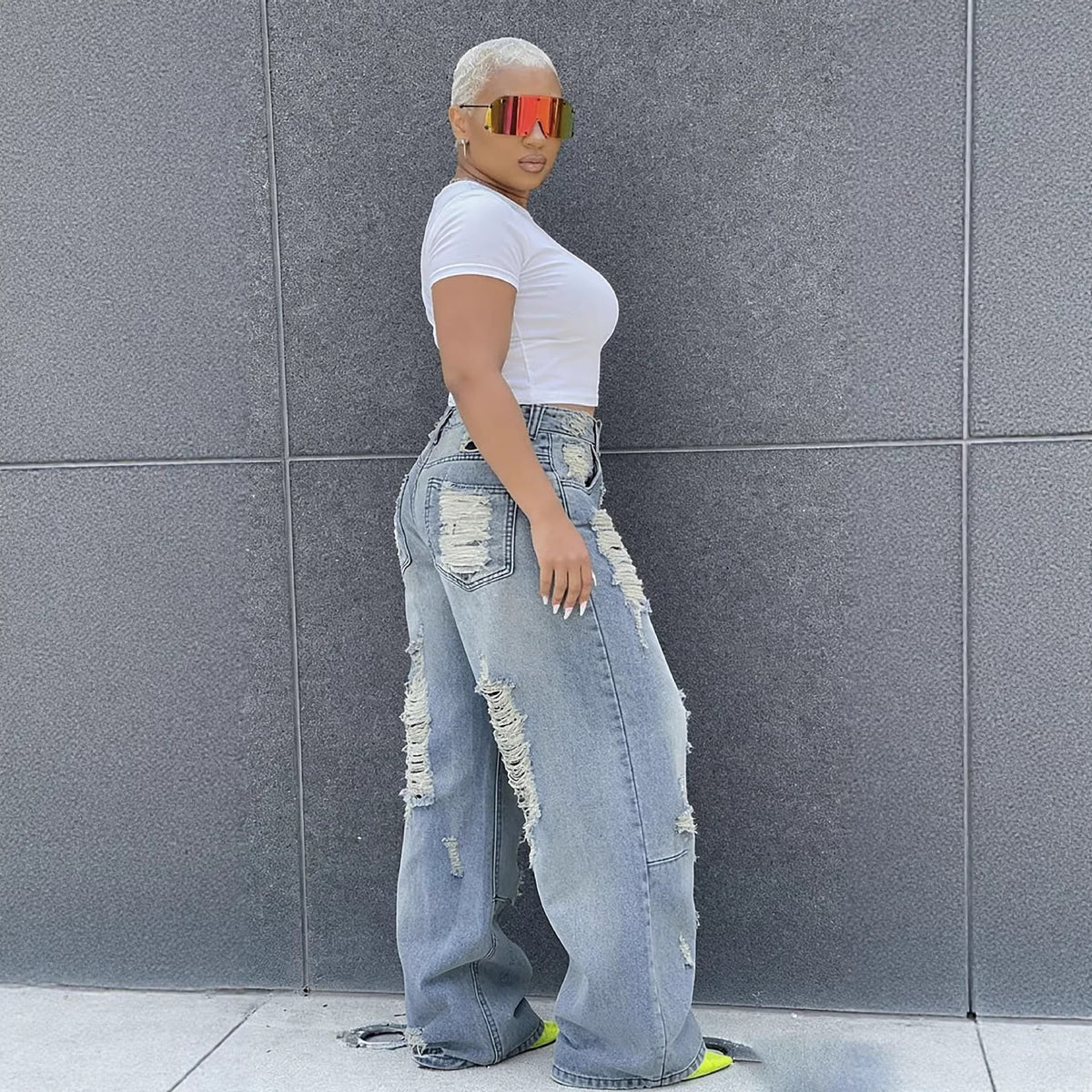 Washed straight-leg ripped jeans by Plush Fashion Hub featuring distressed details and casual fit, shown on a model.