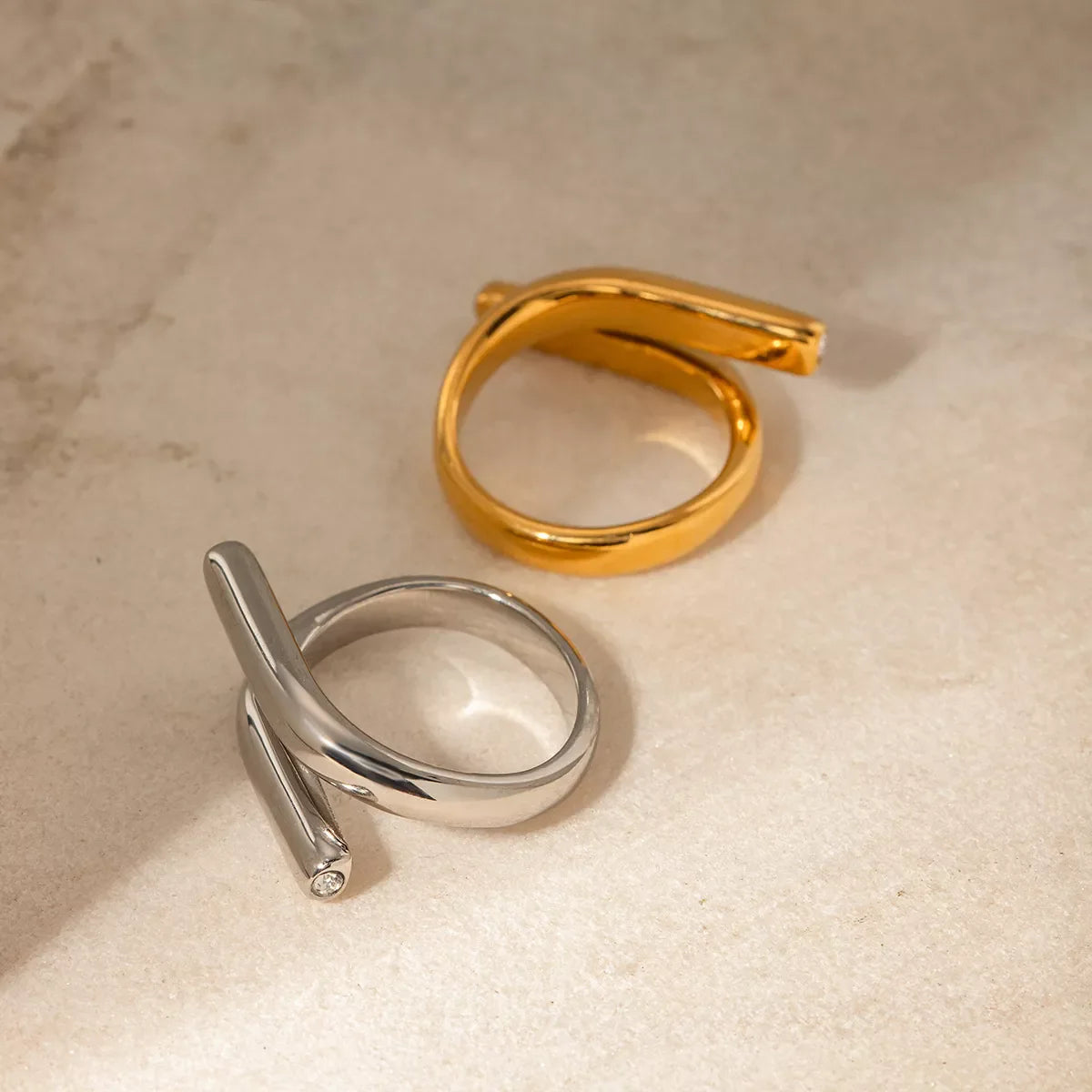 Stainless steel bypass ring from Plush Fashion Hub featuring a sleek, modern design, perfect for contemporary jewelry styles.