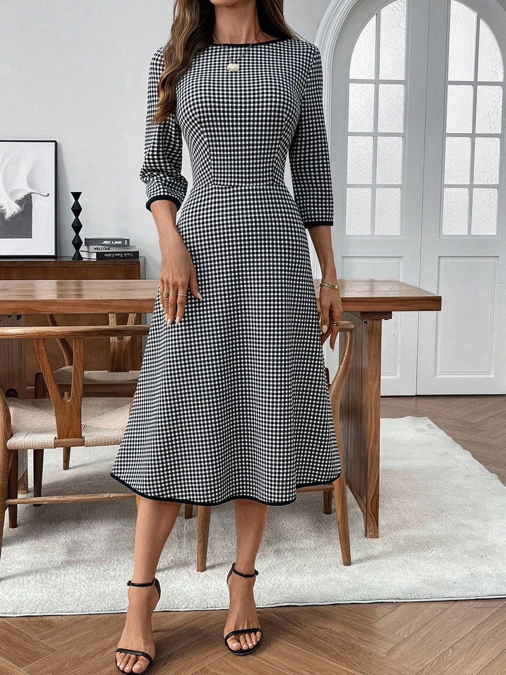 Classic plaid round neck midi dress with 3/4 sleeves from Trendsi, featuring a stylish, comfortable design perfect for casual wear.