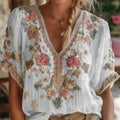 Women's artistic retro V-neck short-sleeve top by FitiqueFit featuring 3D print, casualwear style with vibrant design.