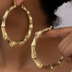 Stainless steel textured hoop earrings by Shopimist, showcasing large, round hoops with a detailed textured finish.