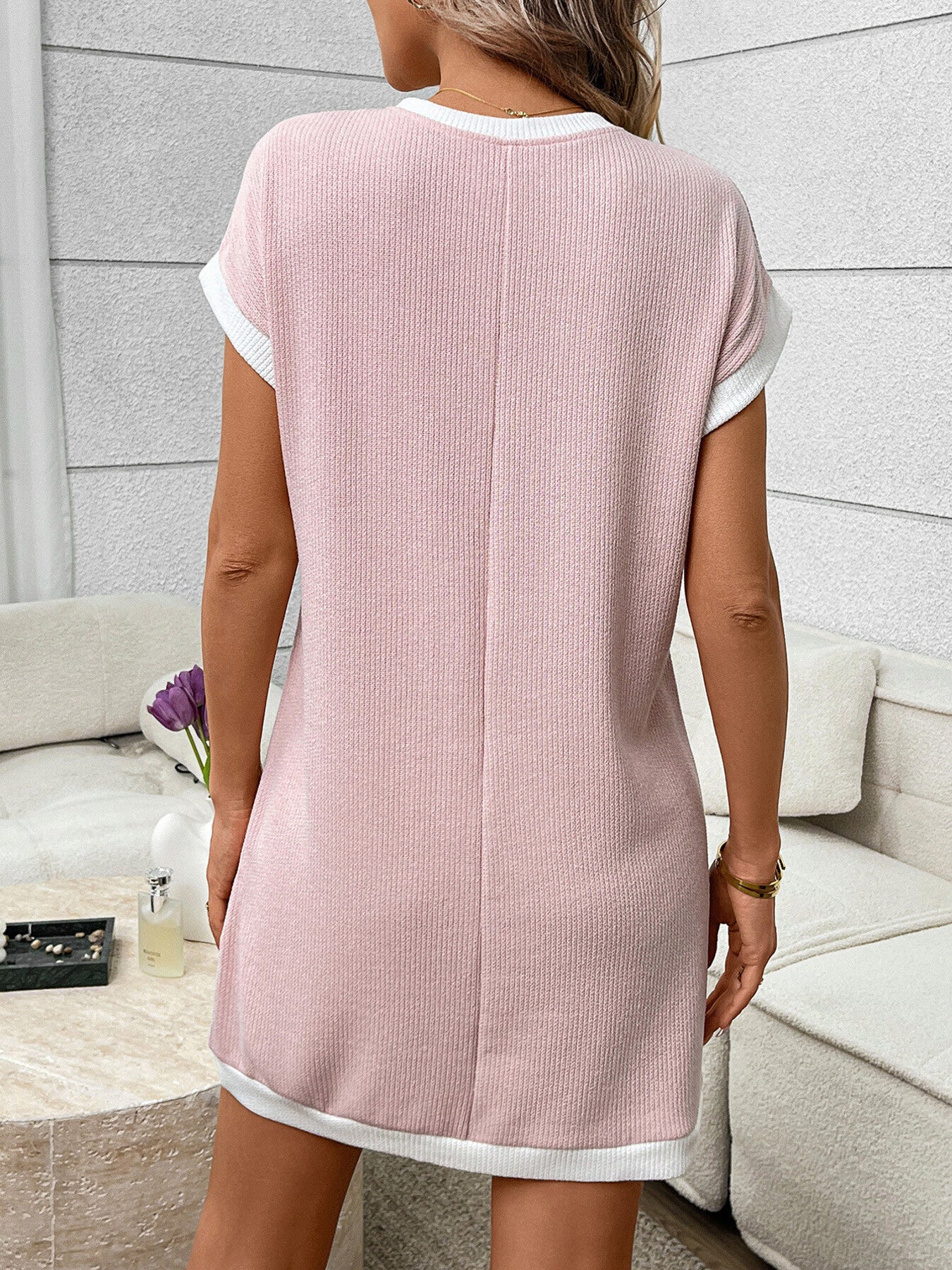 Contrast trim ribbed knit mini dress with functional pocket, featuring a fitted silhouette and stylish design from Trendsi.