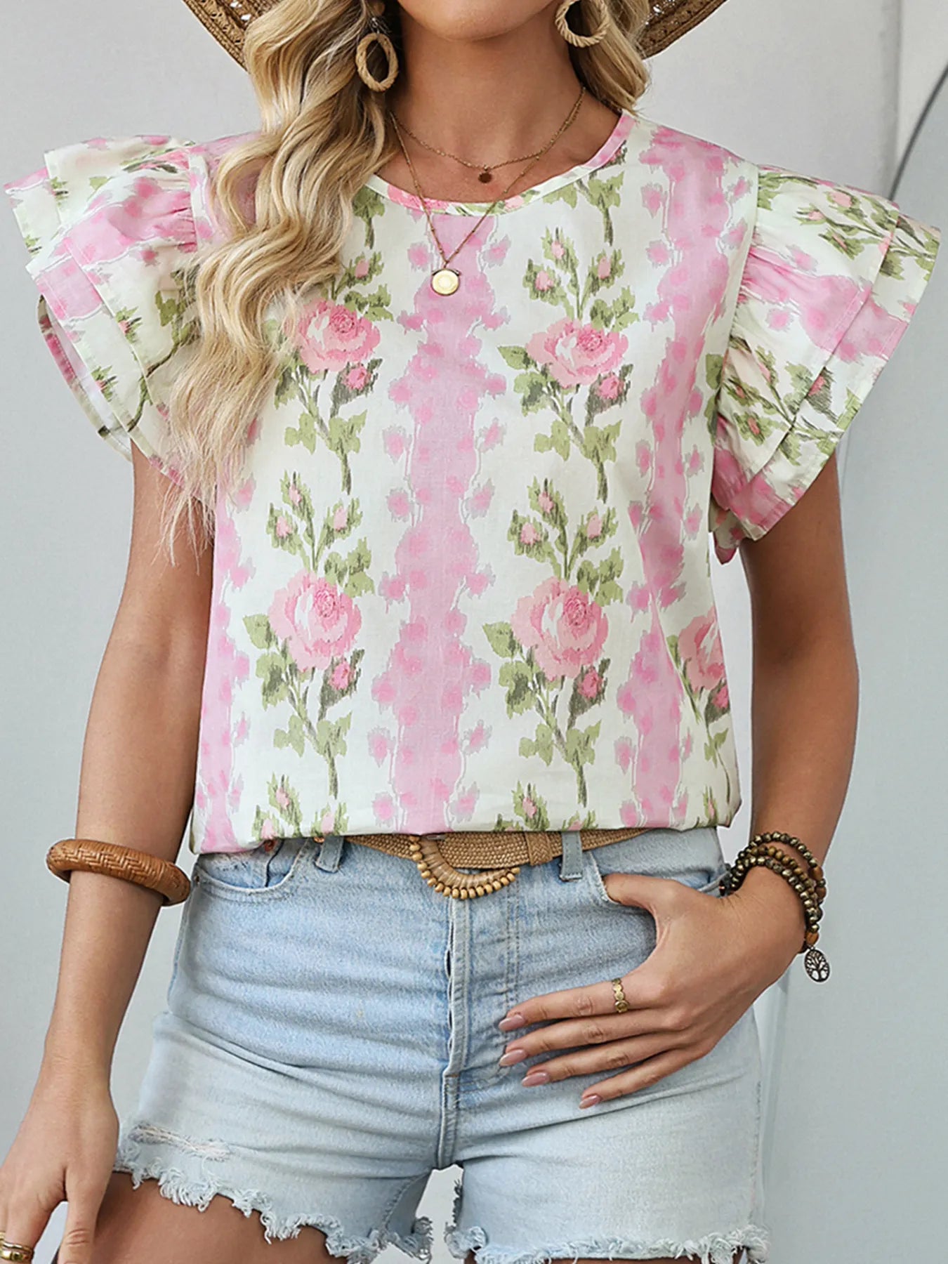 Floral print ruffled sleeve blouse by Plush Fashion Hub, showing the detailed floral pattern and ruffled sleeve design.