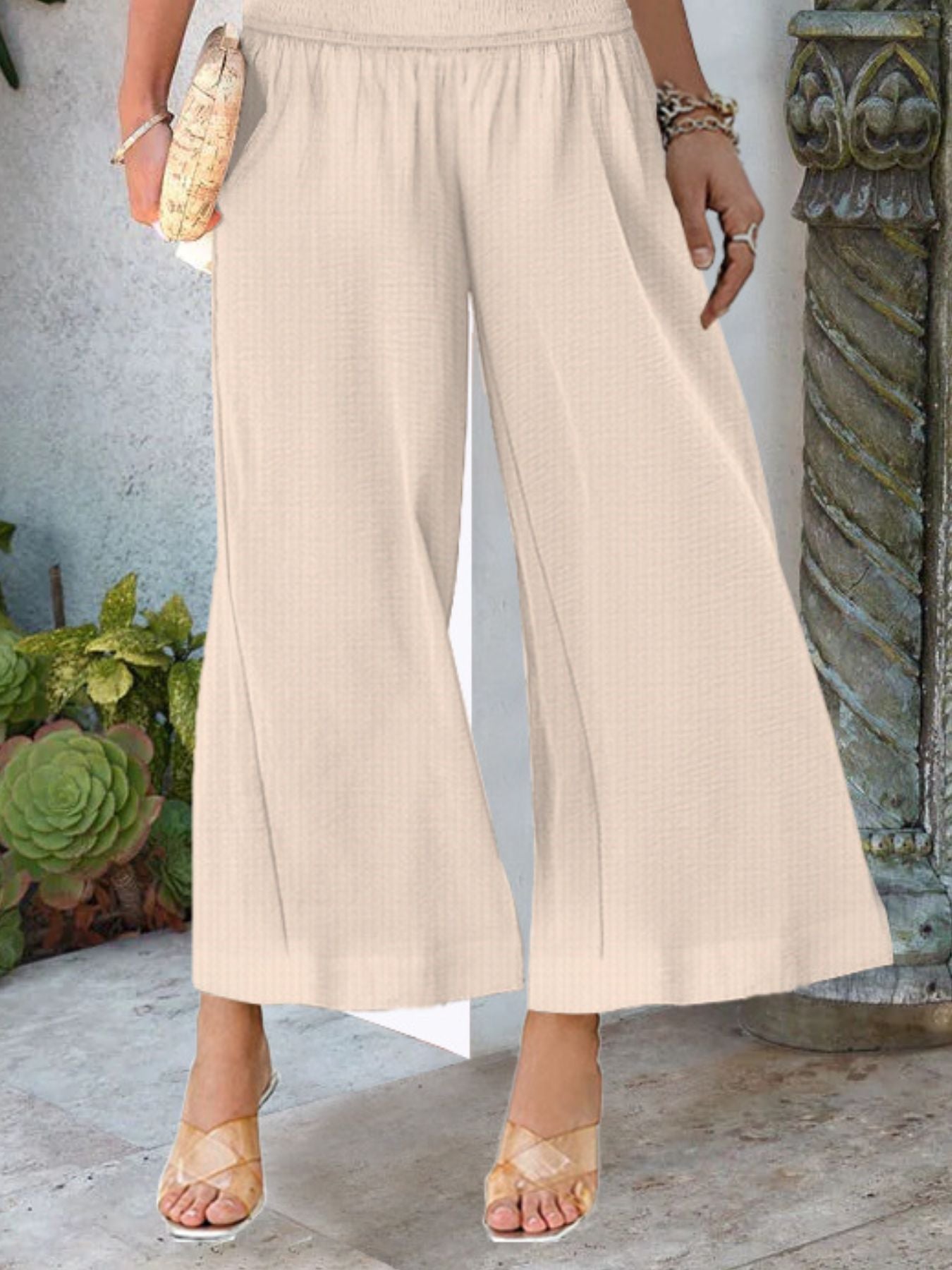 Women's lightweight wide-leg casual trousers with smocked waist by Trendsi, featuring a relaxed fit and comfortable design.