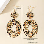 Leopard print dangle earrings from Shopimist featuring gold hooks and bold animal print design.
