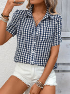 Women's lightweight plaid button-up short sleeve shirt by Trendsi, showing the classic plaid pattern and collar detail.
