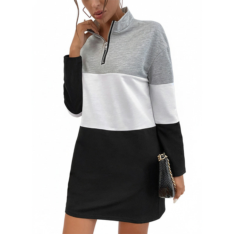 Colorblock casual sweatshirt dress in grey, white, and black with a quarter zipper and stand-up collar.