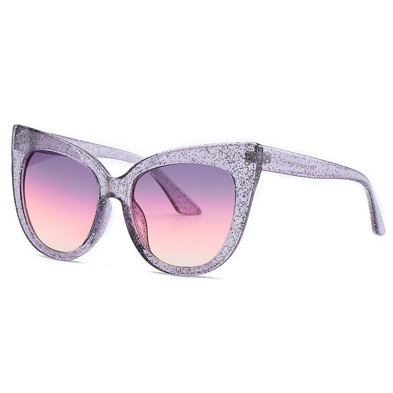 Women's oversized cat eye sunglasses with UV400 protection from Plush Fashion Hub, featuring stylish black frames and dark lenses.