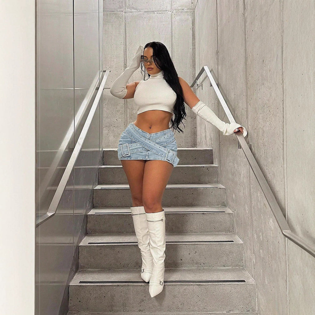 Light blue denim mini skirt for women with bodycon fit and cross-over buckle design by FitiqueFit.