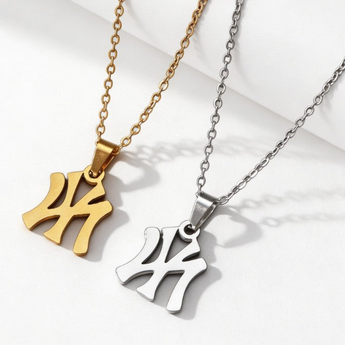 Gold and silver metal chain necklaces with stylized interlocking letter pendants.