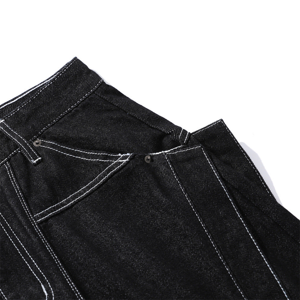 Black denim jeans with white topstitching, front pockets, and metal rivets.