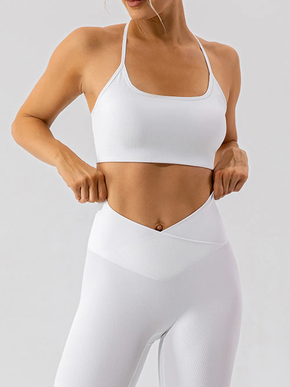 Black spaghetti strap active bra from Trendsi, featuring breathable fabric and slim straps for comfortable workout wear.