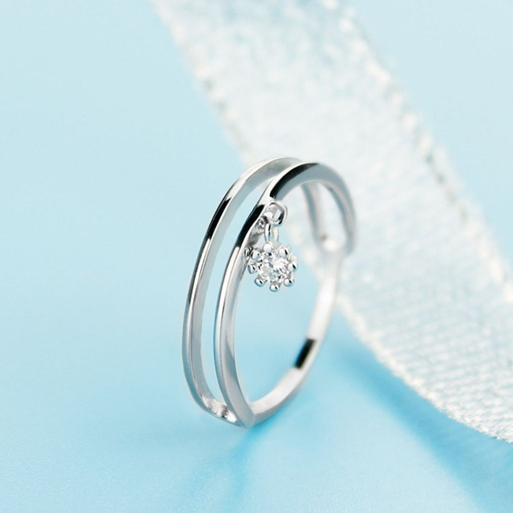 Sterling silver double layered ring with intricate design, showcasing a shiny 925 silver finish and elegant craftsmanship.