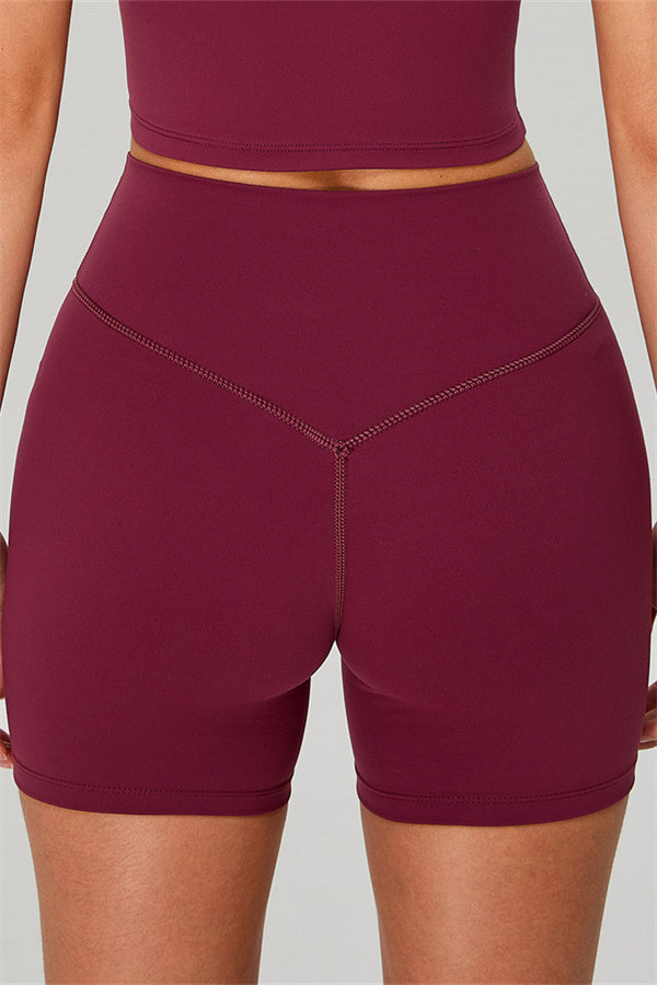 Fitglutes activewear one-shoulder crop top and shorts 2-piece set, stylish gymwear and sportswear for workout and fitness.