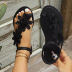 Floral embellished flat sandals by Shopimist featuring colorful flower details and comfortable open-toe design.