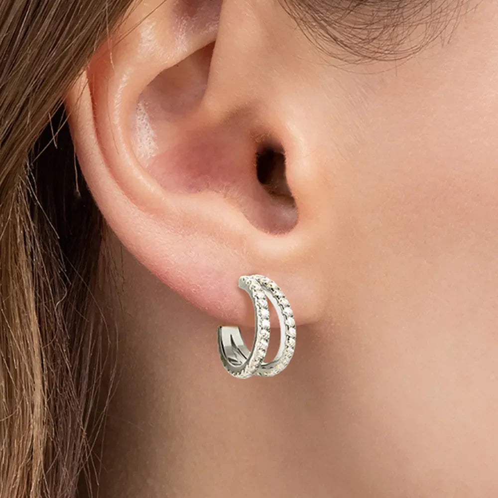 Sterling silver C-hoop earrings with sparkling moissanite stones, stylish jewelry from Shopimist in a close-up image.