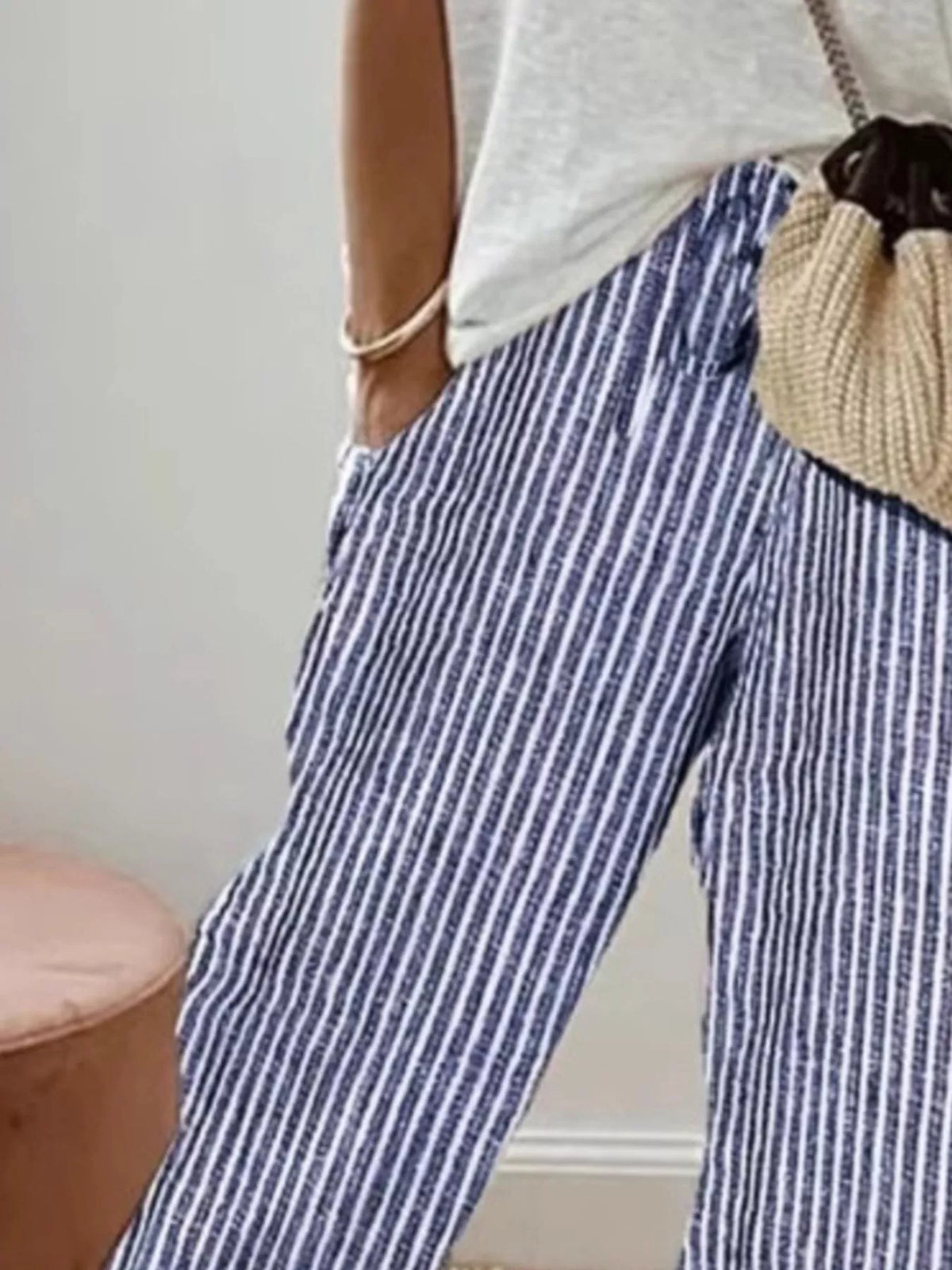 Striped cropped pants by Plush Fashion Hub featuring a stylish design, with a fitted waist and tapered leg silhouette.