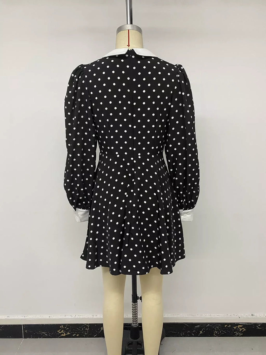 Polka dot Peter Pan collar dress by Shopimist featuring a classic design with a rounded collar and playful polka dot pattern.