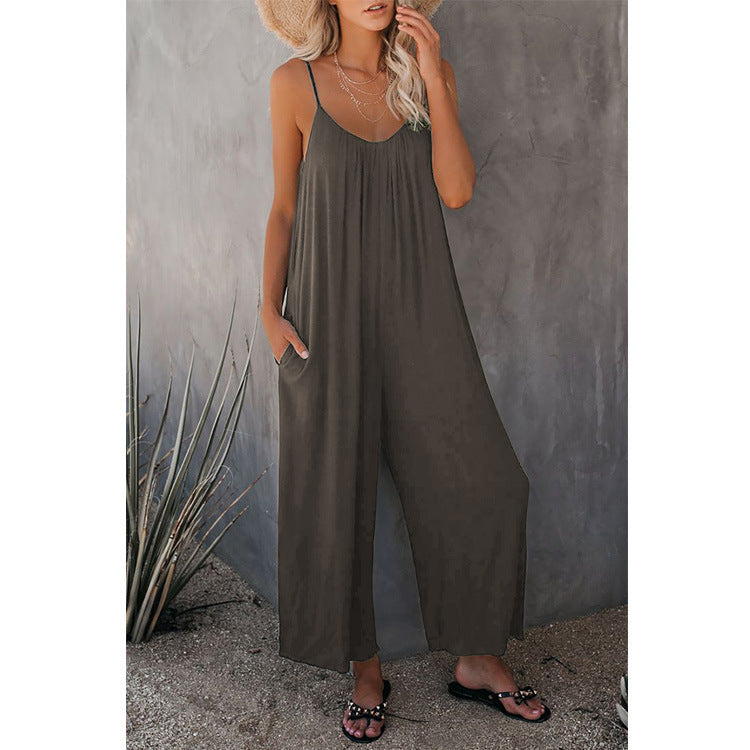 Women's pleated chest cross-strap jumpsuit by Plush Fashion Hub, featuring a stylish, fitted design with pleats and cross-back straps.
