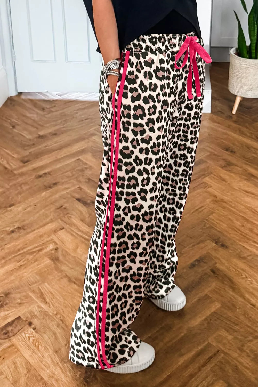 Leopard print casual pants with drawstring waist and regular fit from Plush Fashion Hub, shown on a model.