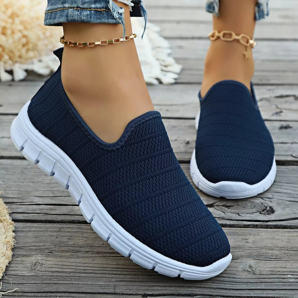 Women's breathable mesh slip-on casual walking flats by Trendsi, lightweight and comfortable footwear for everyday wear.