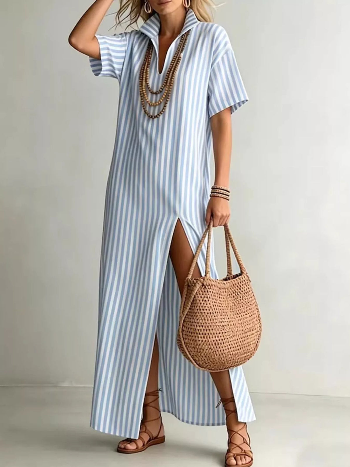 Striped high slit maxi shirt dress by Plush Fashion Hub featuring bold vertical stripes and a flowing, elegant design.